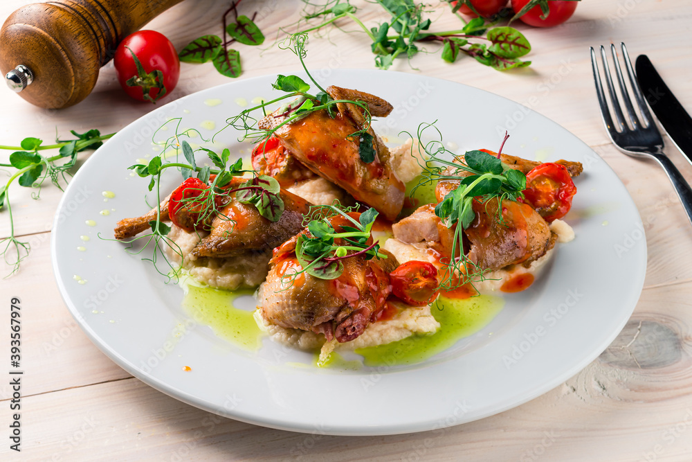 fried partridge on a white plate fried partridge on a white plate