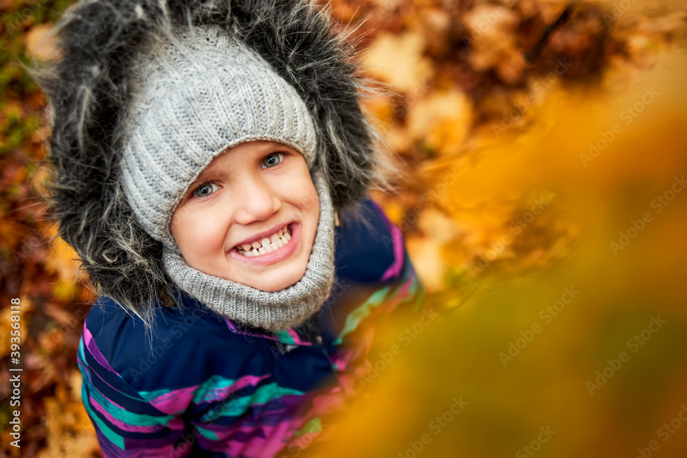 Autumn portrait of cute little caucasian girl in the cold forest Autumn portrait of cute little caucasian girl in the cold forest