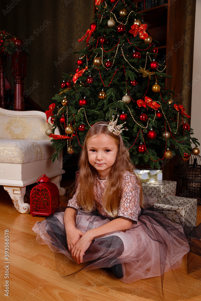 a cute little girl in a dress getting ready for New Year's. a cute little girl in a dress getting ready for New Year's.