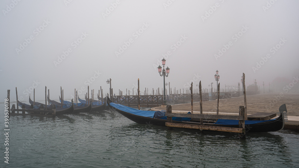 Gondolas in Venice in the mist