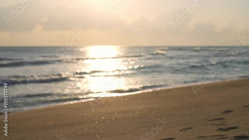 Wallpaper Mural Sunset on beach by sea, sunlight's reflection on the water, from blurry to clear Torontodigital.ca