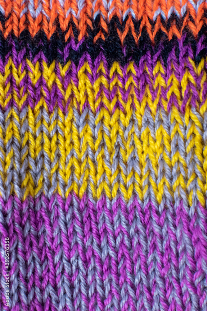 knitted wool texture in purple and yellow 