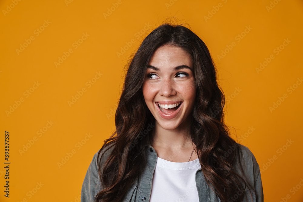 Cheerful beautiful girl smiling and looking aside Cheerful beautiful girl smiling and looking aside