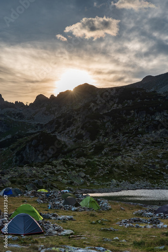 Sunset above peaks from camping area near Bucura lake in Retezat mountains in Romania © honza28683