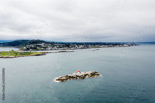 Aerial view of The Muglins Lighthouse in County Dublin, Ireland photo