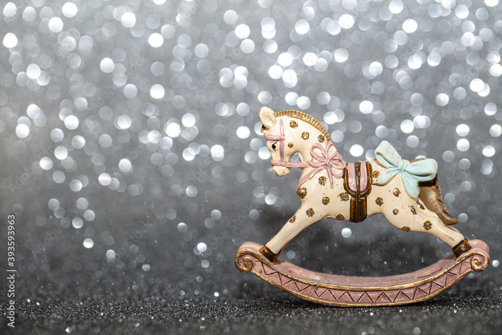 rocking horse christmas toy on silver background