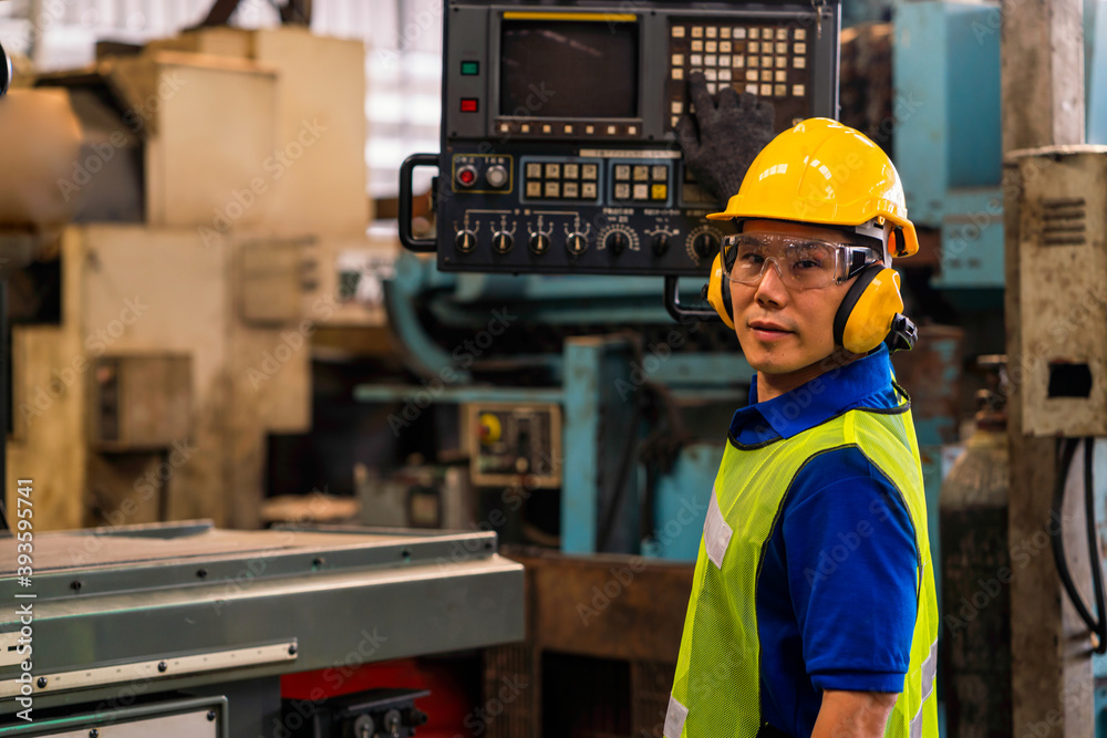 Professional technicians are controlling industrial machinery online. Engineer working and control robot with remote. Young technicians factory worker controlling the work. Professional technicians are controlling industrial machinery online. Engineer working and control robot with remote. Young technicians factory worker controlling the work.