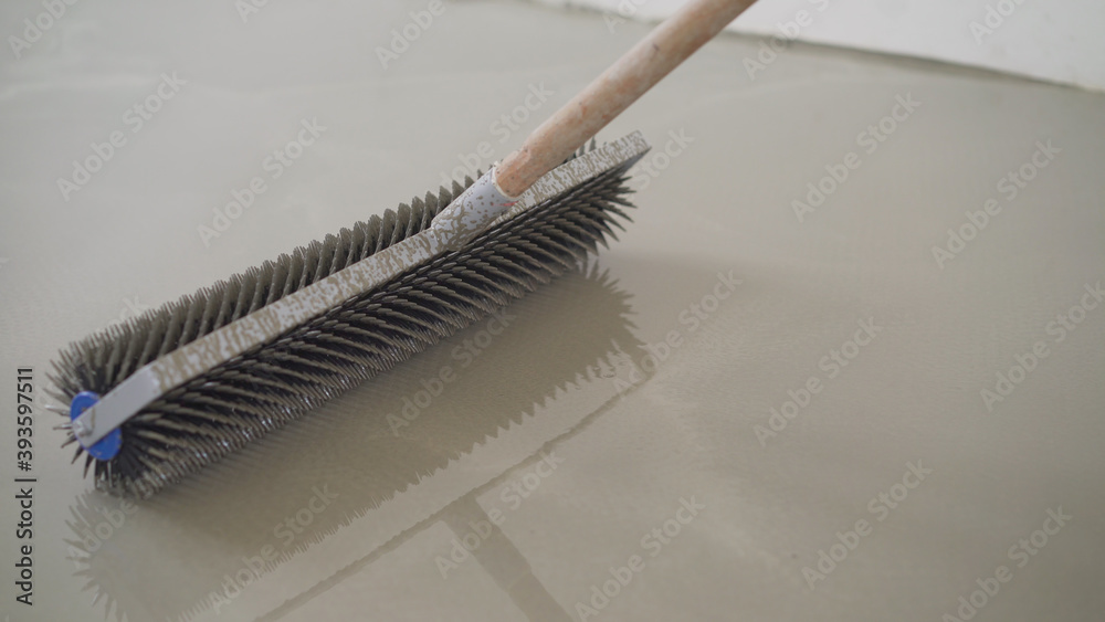 Charcoal roller on the self-leveling floor. Charcoal roller. Self ...