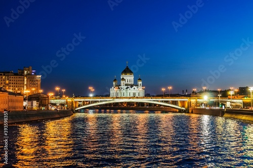 View of the Big Stone Bridge and the Cathedral of Christ the Savior in the late evening in August from the Moscow River. Moscow, Russia.