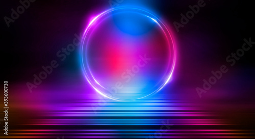 Dark abstract background. Neon light circle figure. Reflection of neon light on the water. 