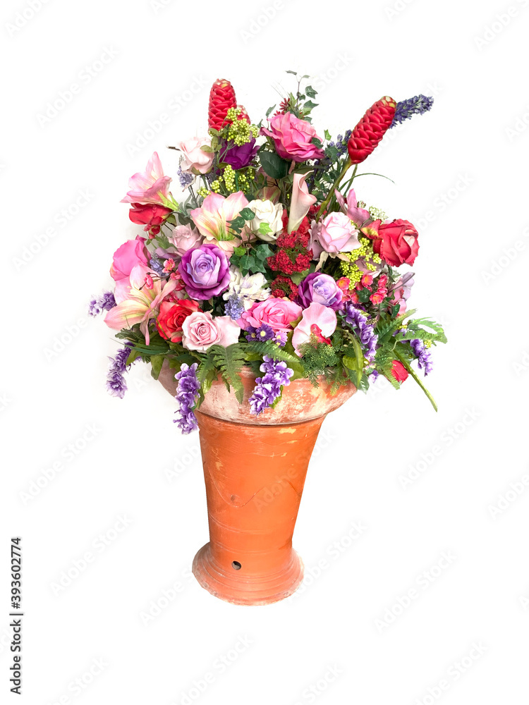 Red, pink and purple flowers in a vase on a white background