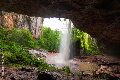 Mountain day summer. Waterfall Caucasus, mainsail cave