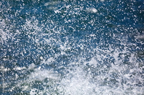 Splashing water in the sea as an abstract background. © schankz
