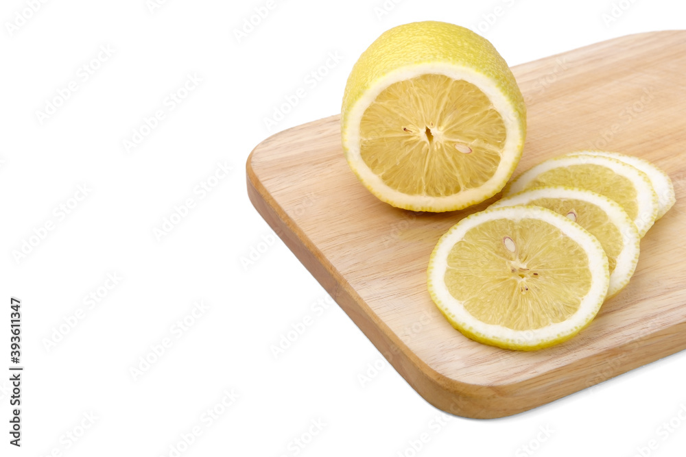 Lemon slices lie on a wooden board isolated on a white background. Lemon slices lie on a wooden board isolated on a white background.