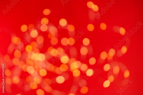 Christmas holiday background with festive bokeh on red background. Ready-to-install products. blur and bokeh. holiday blur lights. copy space. space for text