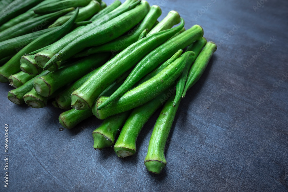 Fresh okra, lady finger, on gray table Fresh okra, lady finger, on gray table