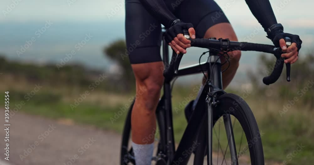 Active male cyclist riding black sports professional bicycle