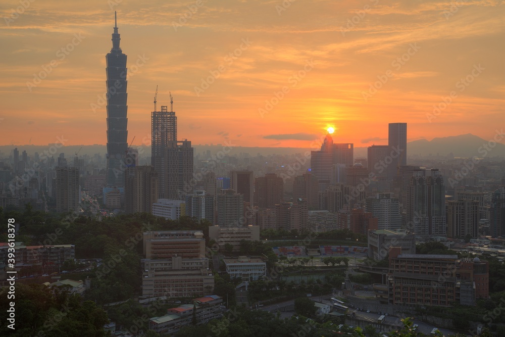 Aerial panorama of downtown Taipei City with Taipei 101 Tower among skyscrapers under dramatic sky ~ A romantic evening in Taipei, the capital city of Taiwan, with beautiful rosy afterglow at sunset