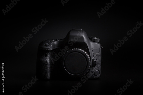 DSLR camera body on black background
