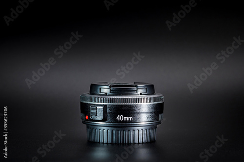 Lens for DSLR camera on black blackground.