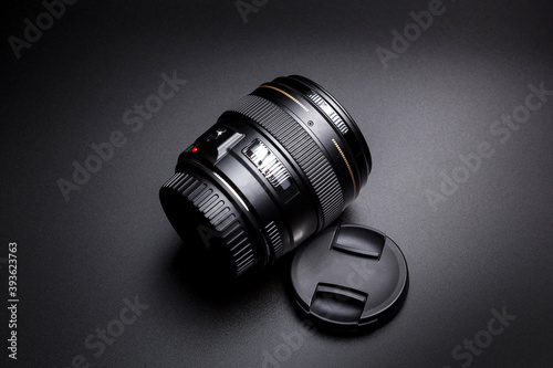 Photography Lens for DSLR camera on black blackground.
