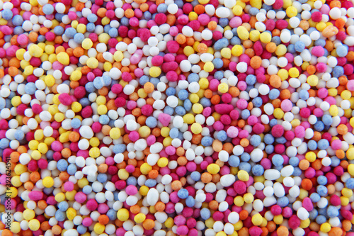 hundreds and thousands sprinkles tiny sugar beads for decorating cakes and desserts background texture
