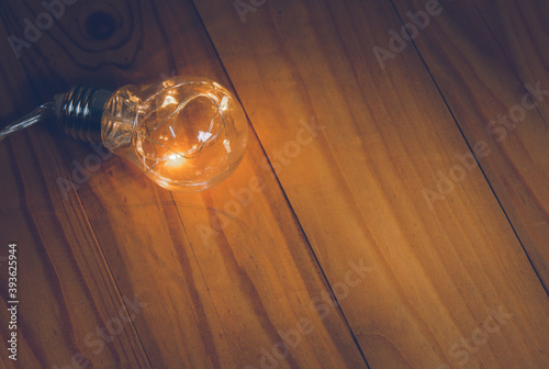 Light bulbs over wooden background