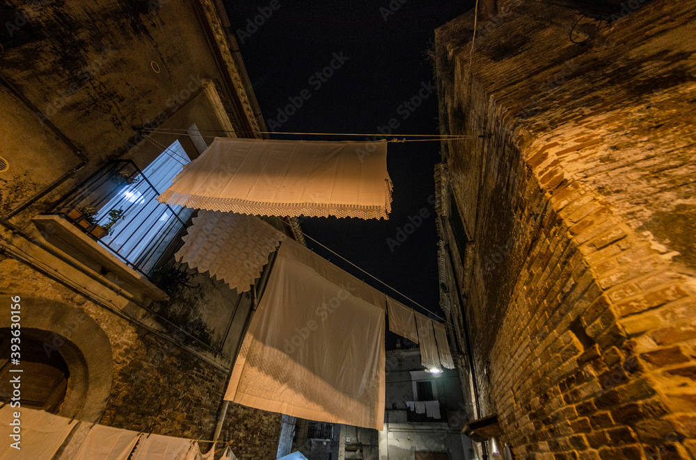 Typical view of a country lane in southern Italy with laundry hanging out to dry