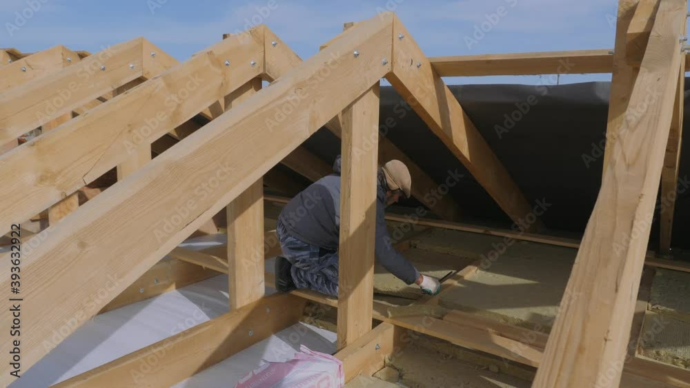Construction work. Installation of insulation using. Construction work. Installation of insulation using.