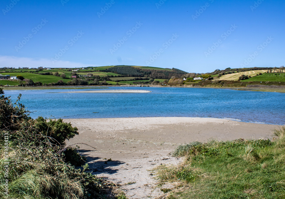 Summer on the sandy beaches of West Cork Ireland with beautiful Blue water in the background.