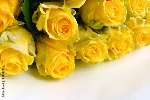 Beautiful bouquet of yellow roses close up  selective focus. Heads of blossom flowers. Flowers background  soft focus 