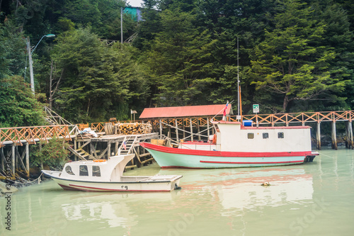 Caleta Tortel / Aysen / Chile - 01/26/ 2018: Wooden boats by the bay of Caleta Tortel, Patagonia. photo