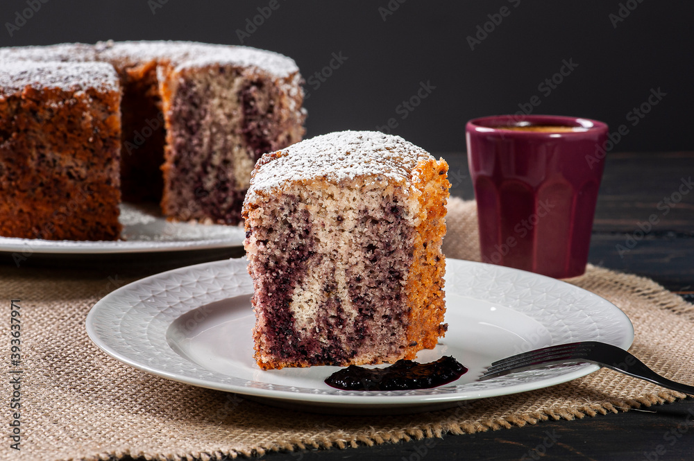 .Piece of blackberry jam cake on a white plate .Piece of blackberry jam cake on a white plate