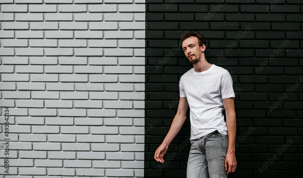 Young bearded hipster guy wearing white blank t-shirt. Mock-up for print. T-shirt template. Young bearded hipster guy wearing white blank t-shirt. Mock-up for print. T-shirt template.