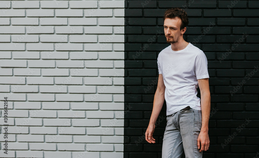 Young bearded hipster guy wearing white blank t-shirt. Mock-up for print. T-shirt template. Young bearded hipster guy wearing white blank t-shirt. Mock-up for print. T-shirt template.