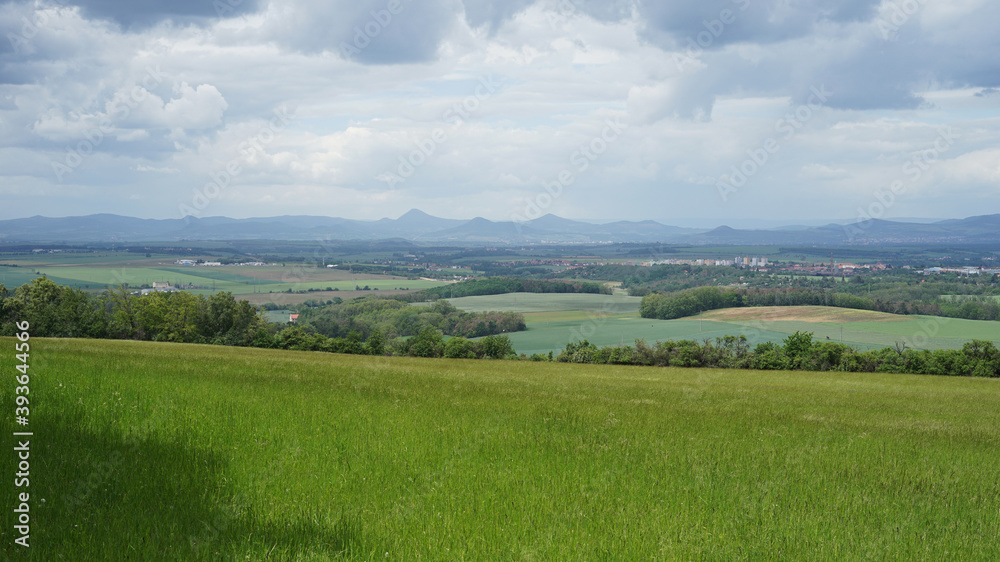 Czech Central Mountains (Ceske stredohori) with meadows and volcanoes hills panoramic view from Rip Mountain
