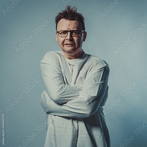 crazy man in straitjacket on a blue background
