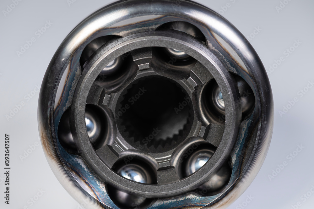 New automotive CV joints on a gray background. New background parts for articles New automotive CV joints on a gray background. New background parts for articles