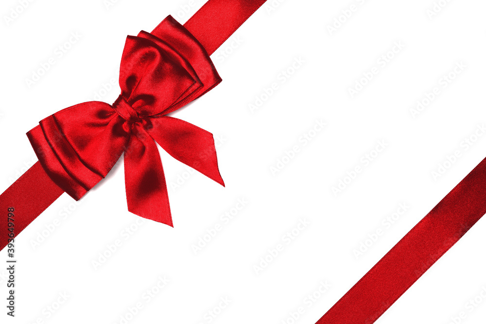 Red satin bow and ribbon isolated on white background Red satin bow and ribbon isolated on white background