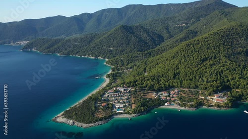 Aerial drone video of beautiful tranquil turquoise beach of Antrines near famous Panormos beach, Skopelos island, Sporades, Greece photo
