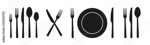 Spoon, fork, knife and plate set icons on black background. Silhouettes of cutlery. Food, dinning, kitchen, menu, restaurant, signs. Vector illustration.