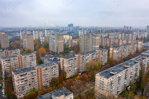 Dormitory district (bedroom community) of the Soviet architecture on a autumn foggy day. Residential apartment buildings (block of flats) of the Soviet period. Aerial view