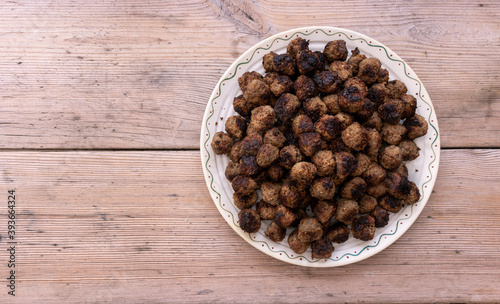 Swedish meatballs on a beautiful Christmas plate with space for recipes. Köttbullar
