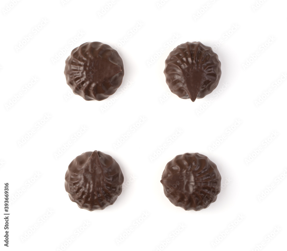 Chocolate-covered marshmallows are laid out on a white background. The view from the top. The concept of desserts. Chocolate-covered marshmallows are laid out on a white background. The view from the top. The concept of desserts.