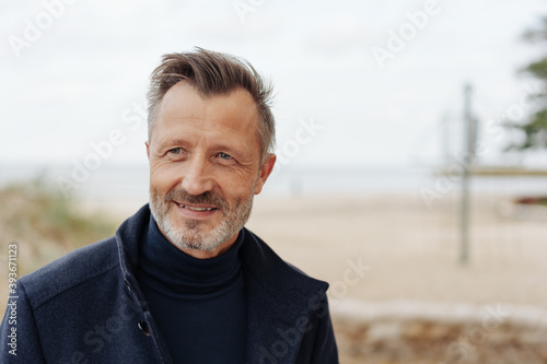 Man looking aside with a thoughtful expression