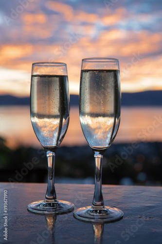 Champagne Toast at Sunset. New Years Eve.