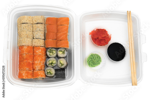 Four sets of rolls in a disposable dish on a white background
