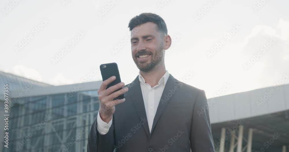 Extremely Happy Successful Businessman becoming Win, making sign of Winner with his Hand, getting great Emotions. Concept of Successful Lifestyle, Business People, Winner, great News.