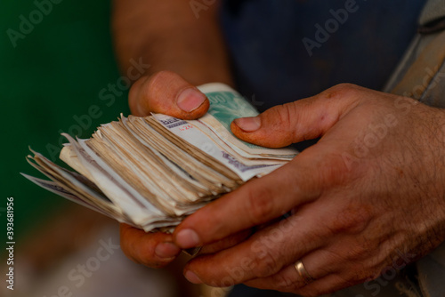 Hands counting Cuban money