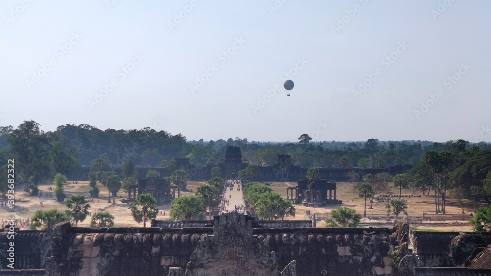 Obraz premium View of the outskirts of Angkor Wat and a hot air balloon. Khmer temple. Unesco World Heritage Site. Siem Reap Province. Cambodia. South-East Asia